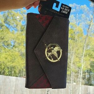 The Hunger Games Brown And Red Clutch Wristlet with Mockingjay Emblem. Chain Inc